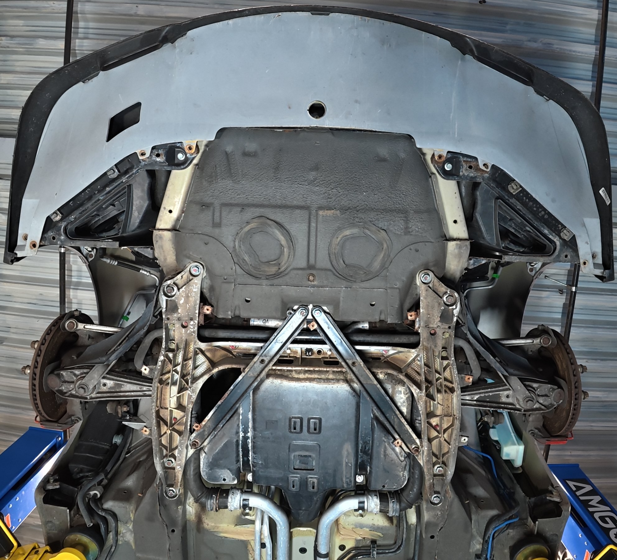 Porsche 911 underbody before treatment — contamination and deposits